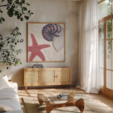 Shimmering Shells II by James Wiens. Shown in a natural wood frame in a cozy modern living room. Available as an archival giclee rolled canvas, fine art paper, or poster print. SKU 72587a.