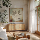 Silver Leaves III by James Wiens. Shown in a natural wood frame in a cozy modern living room. Available as an archival giclee rolled canvas, fine art paper, or poster print. SKU 12260a.