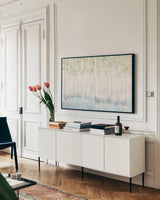 Soft Birches Crop by James Wiens. shown as a framed stretched canvas in a living room above a console. Available as a archival giclee rolled canvas, fine art paper, or poster print. SKU 48446i.
