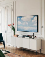 Sparkling Sea by James Wiens. shown as a framed stretched canvas in a living room above a console. Available as a archival giclee rolled canvas, fine art paper, or poster print. SKU 63187i.