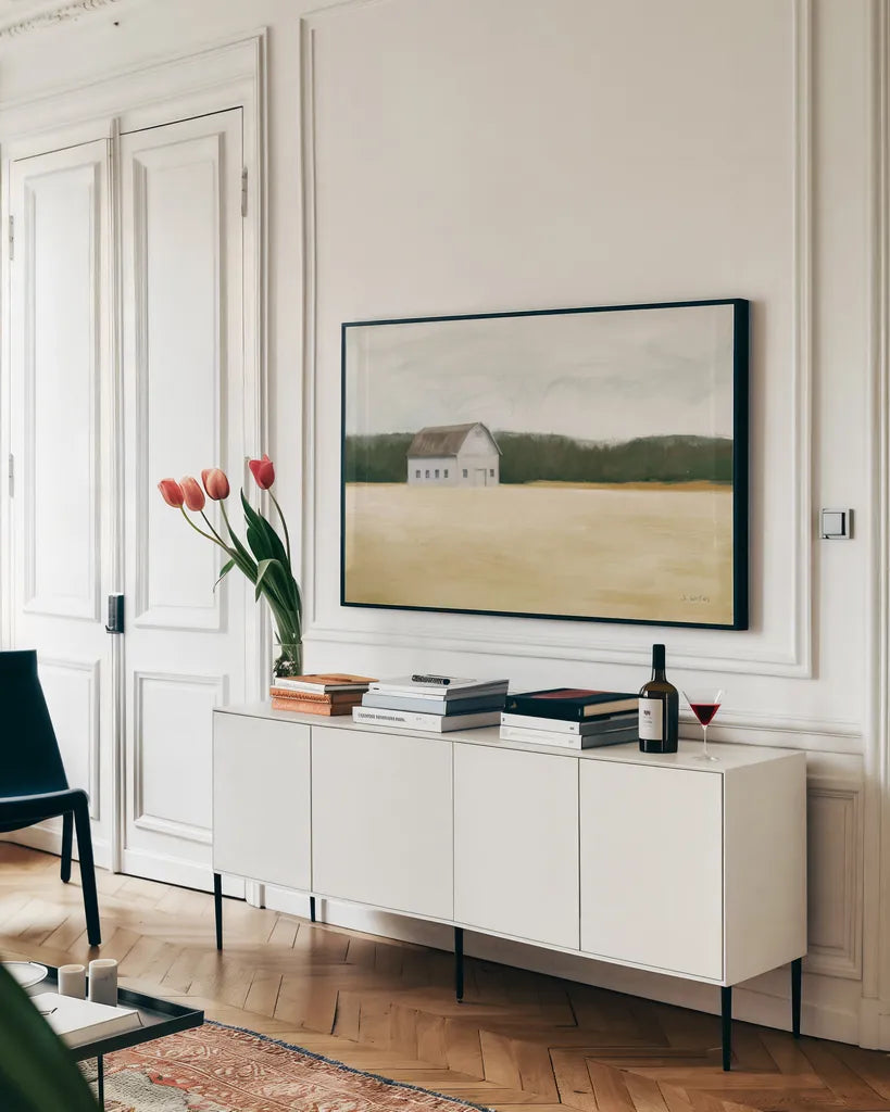 Spring Barn by James Wiens. shown as a framed stretched canvas in a living room above a console. Available as a archival giclee rolled canvas, fine art paper, or poster print. SKU 95007i.