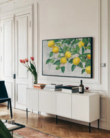 Zesty Lemons by James Wiens. shown as a framed stretched canvas in a living room above a console. Available as a archival giclee rolled canvas, fine art paper, or poster print. SKU 70064i.