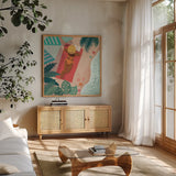 Beach Babes I by Janelle Penner. Shown in a natural wood frame in a cozy modern living room. Available as an archival giclee rolled canvas, fine art paper, or poster print. SKU 67175a.