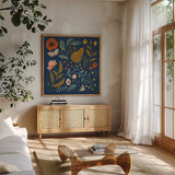 Blue Botanical II by Janelle Penner. Shown in a natural wood frame in a cozy modern living room. Available as an archival giclee rolled canvas, fine art paper, or poster print. SKU 48601a.