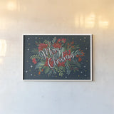 Christmas Bloom I by Janelle Penner. shown as a paper print in a white frame. Available as a archival giclee rolled canvas, fine art paper, or poster print. SKU 38727i.