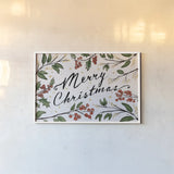 Christmas Lovebirds Greenery by Janelle Penner. shown as a paper print in a white frame. Available as a archival giclee rolled canvas, fine art paper, or poster print. SKU 59682i.