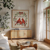 Christmas Lovebirds XI by Janelle Penner. Shown in a natural wood frame in a cozy modern living room. Available as an archival giclee rolled canvas, fine art paper, or poster print. SKU 46757a.