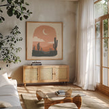 Desert II Sq by Janelle Penner. Shown in a natural wood frame in a cozy modern living room. Available as an archival giclee rolled canvas, fine art paper, or poster print. SKU 80643a.