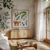 Jungle Love IV White by Janelle Penner. Shown in a natural wood frame in a cozy modern living room. Available as an archival giclee rolled canvas, fine art paper, or poster print. SKU 56358a.