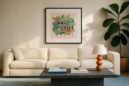 Jungle Vibes VII - Be Wild and Free Pink by Janelle Penner. Displayed in a glass frame with matte in a clean modern living room. Available as an archival giclee rolled canvas, fine art paper, or poster print. SKU 47198a.