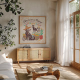 La Calaca II by Janelle Penner. Shown in a natural wood frame in a cozy modern living room. Available as an archival giclee rolled canvas, fine art paper, or poster print. SKU 75214a.