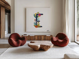 Romantic Luxe E Navy by Janelle Penner. Shown as extra-large giant wall art in a modern living room. Available as an archival giclee rolled canvas, fine art paper, or poster print. SKU 48599a.