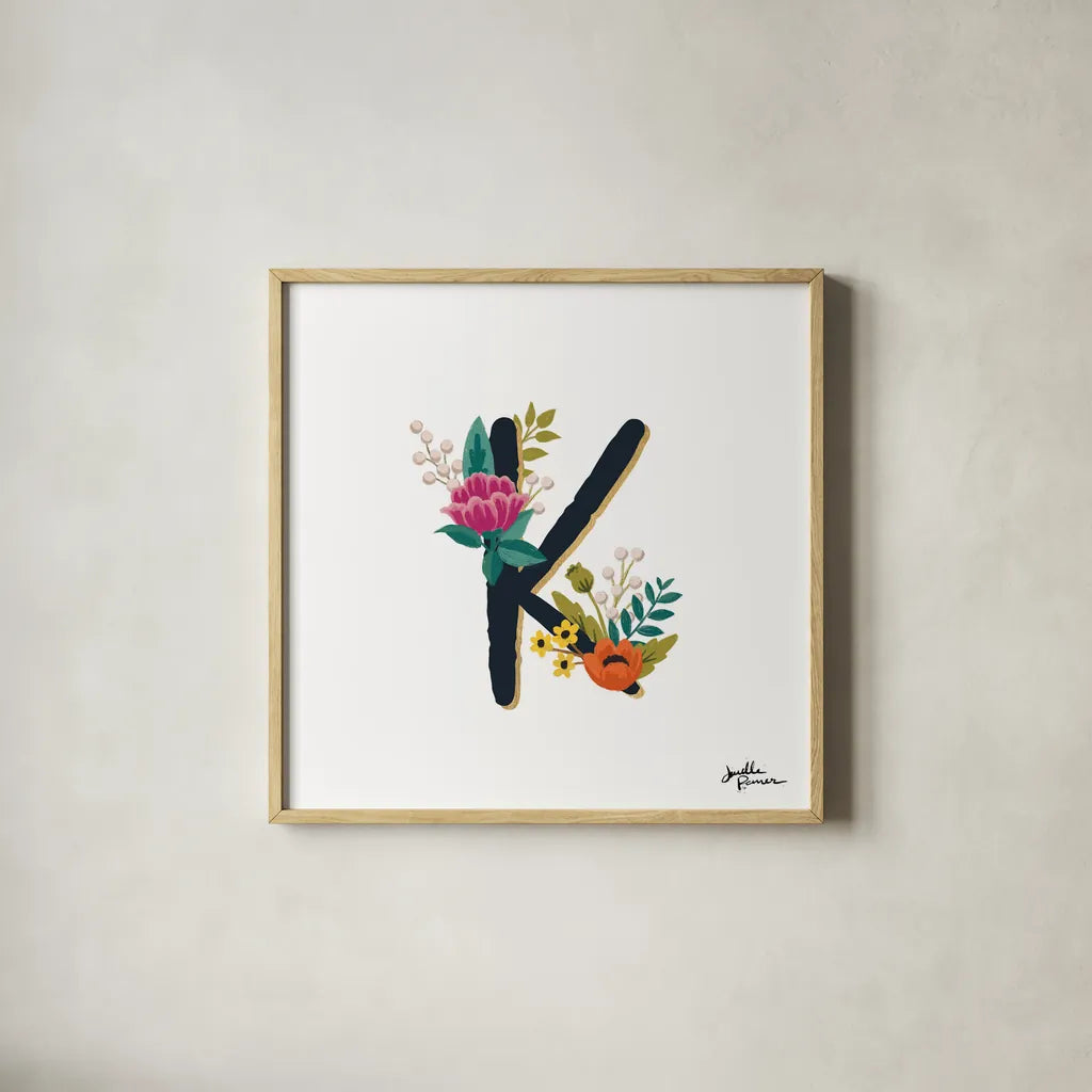 Romantic Luxe Monogram K Black by Janelle Penner. Shown in a natural wood glass frame for a timeless modern aesthetic. Available as an archival giclee rolled canvas, fine art paper, or poster print. SKU 38237a.