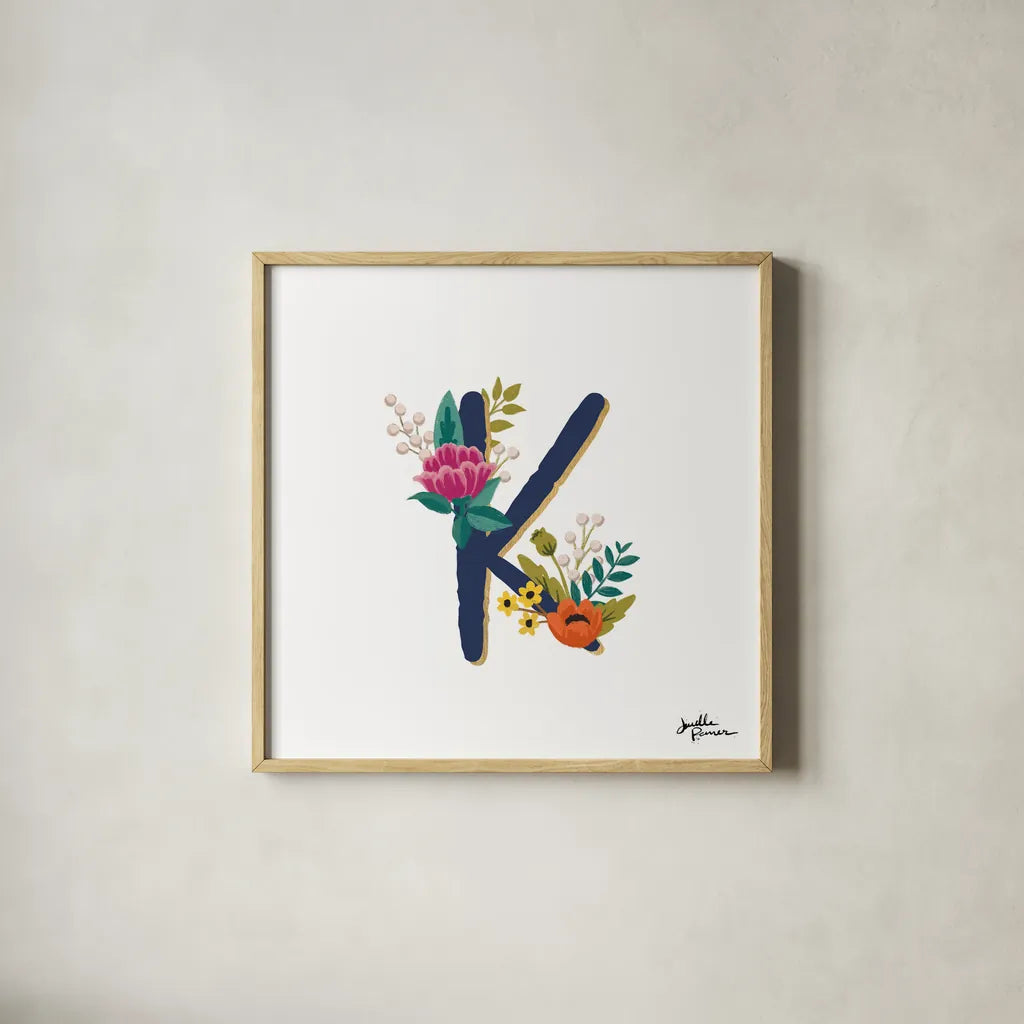 Romantic Luxe Monogram K Navy by Janelle Penner. Shown in a natural wood glass frame for a timeless modern aesthetic. Available as an archival giclee rolled canvas, fine art paper, or poster print. SKU 38276a.