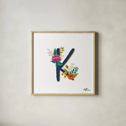 Romantic Luxe Monogram K Navy by Janelle Penner. Shown in a natural wood glass frame for a timeless modern aesthetic. Available as an archival giclee rolled canvas, fine art paper, or poster print. SKU 38276a.