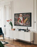 Santas List II Black by Janelle Penner. shown as a framed stretched canvas in a living room above a console. Available as a archival giclee rolled canvas, fine art paper, or poster print. SKU 68425i.