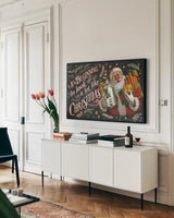 Santas List IV Black by Janelle Penner. shown as a framed stretched canvas in a living room above a console. Available as a archival giclee rolled canvas, fine art paper, or poster print. SKU 68423i.