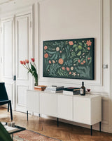 Seaside Botanical I Dark by Janelle Penner. shown as a framed stretched canvas in a living room above a console. Available as a archival giclee rolled canvas, fine art paper, or poster print. SKU 57013i.