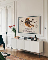 Spooktacular I Witches Hats by Janelle Penner. shown as a framed stretched canvas in a living room above a console. Available as a archival giclee rolled canvas, fine art paper, or poster print. SKU 49062i.