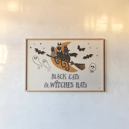 Spooktacular I Witches Hats by Janelle Penner. shown as a paper print in a natural frame. Available as a archival giclee rolled canvas, fine art paper, or poster print. SKU 49062i.
