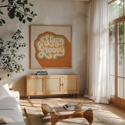 Stay Groovy I by Janelle Penner. Shown in a natural wood frame in a cozy modern living room. Available as an archival giclee rolled canvas, fine art paper, or poster print. SKU 65226a.