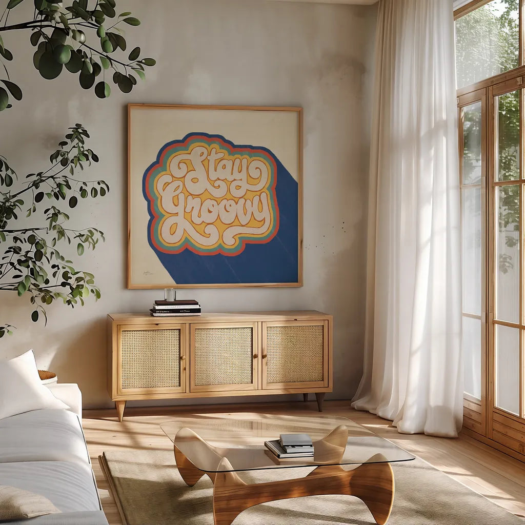 Stay Groovy I Bright by Janelle Penner. Shown in a natural wood frame in a cozy modern living room. Available as an archival giclee rolled canvas, fine art paper, or poster print. SKU 66923a.