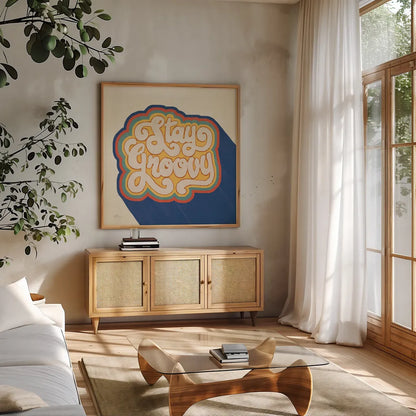 Stay Groovy I Bright by Janelle Penner. Shown in a natural wood frame in a cozy modern living room. Available as an archival giclee rolled canvas, fine art paper, or poster print. SKU 66923a.