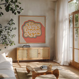 Stay Groovy I Bright by Janelle Penner. Shown in a natural wood frame in a cozy modern living room. Available as an archival giclee rolled canvas, fine art paper, or poster print. SKU 70947a.