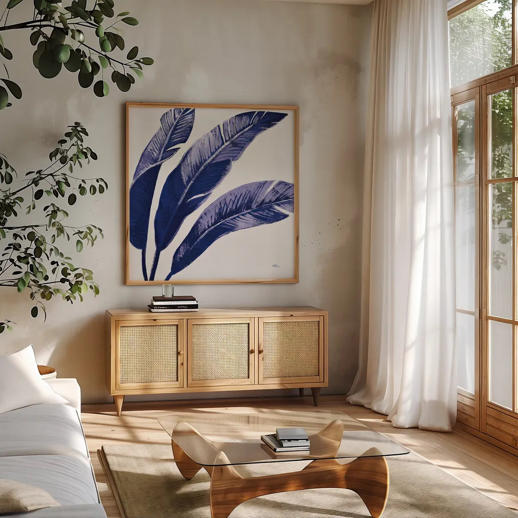 Welcome to Paradise XI Indigo by Janelle Penner. Shown in a natural wood frame in a cozy modern living room. Available as an archival giclee rolled canvas, fine art paper, or poster print. SKU 34077a.