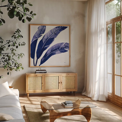 Welcome to Paradise XI Indigo by Janelle Penner. Shown in a natural wood frame in a cozy modern living room. Available as an archival giclee rolled canvas, fine art paper, or poster print. SKU 34077a.