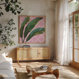 Welcome to Paradise XI on Pink by Janelle Penner. Shown in a natural wood frame in a cozy modern living room. Available as an archival giclee rolled canvas, fine art paper, or poster print. SKU 55311a.