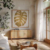 Welcome to Paradise XIII Gold by Janelle Penner. Shown in a natural wood frame in a cozy modern living room. Available as an archival giclee rolled canvas, fine art paper, or poster print. SKU 55647a.