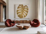 Welcome to Paradise XIII Gold by Janelle Penner. Shown as extra-large giant wall art in a modern living room. Available as an archival giclee rolled canvas, fine art paper, or poster print. SKU 55647a.
