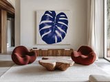 Welcome to Paradise XIII Indigo by Janelle Penner. Shown as extra-large giant wall art in a modern living room. Available as an archival giclee rolled canvas, fine art paper, or poster print. SKU 34079a.