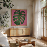 Welcome to Paradise XIII on Pink by Janelle Penner. Shown in a natural wood frame in a cozy modern living room. Available as an archival giclee rolled canvas, fine art paper, or poster print. SKU 33299a.