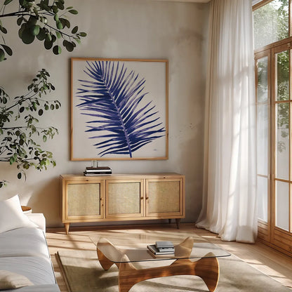 Welcome to Paradise XIV Indigo by Janelle Penner. Shown in a natural wood frame in a cozy modern living room. Available as an archival giclee rolled canvas, fine art paper, or poster print. SKU 34080a.