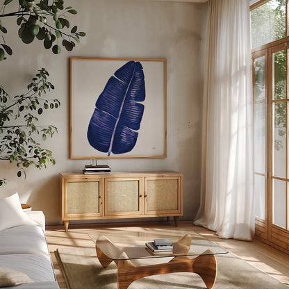 Welcome to Paradise XV Indigo by Janelle Penner. Shown in a natural wood frame in a cozy modern living room. Available as an archival giclee rolled canvas, fine art paper, or poster print. SKU 34081a.