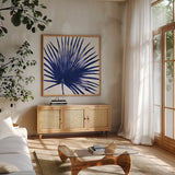 Welcome to Paradise XVI Indigo by Janelle Penner. Shown in a natural wood frame in a cozy modern living room. Available as an archival giclee rolled canvas, fine art paper, or poster print. SKU 34082a.