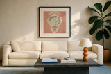 Winter Blooms VI Pink by Janelle Penner. Displayed in a glass frame with matte in a clean modern living room. Available as an archival giclee rolled canvas, fine art paper, or poster print. SKU 75139a.