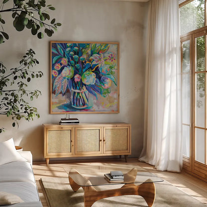 Blossom 24x24 by Jeanette Vertentes. Shown in a natural wood frame in a cozy modern living room. Available as an archival giclee rolled canvas, fine art paper, or poster print. SKU 70559a.