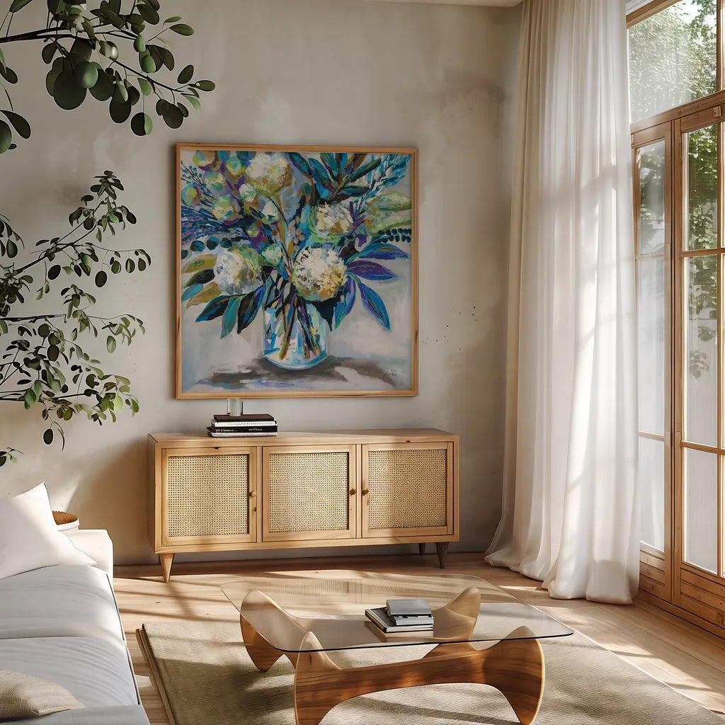 Blue Bloom by Jeanette Vertentes. Shown in a natural wood frame in a cozy modern living room. Available as an archival giclee rolled canvas, fine art paper, or poster print. SKU 87094a.
