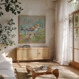 Coastal Plover I by Jeanette Vertentes. Shown in a natural wood frame in a cozy modern living room. Available as an archival giclee rolled canvas, fine art paper, or poster print. SKU 55179a.