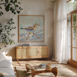 Coastal Plover I Neutral by Jeanette Vertentes. Shown in a natural wood frame in a cozy modern living room. Available as an archival giclee rolled canvas, fine art paper, or poster print. SKU 56824a.