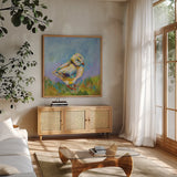 Easter Chick by Jeanette Vertentes. Shown in a natural wood frame in a cozy modern living room. Available as an archival giclee rolled canvas, fine art paper, or poster print. SKU 71465a.