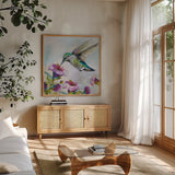 Hummingbird II Florals by Jeanette Vertentes. Shown in a natural wood frame in a cozy modern living room. Available as an archival giclee rolled canvas, fine art paper, or poster print. SKU 63689a.