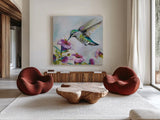 Hummingbird II Florals by Jeanette Vertentes. Shown as extra-large giant wall art in a modern living room. Available as an archival giclee rolled canvas, fine art paper, or poster print. SKU 63689a.