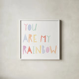 Lets Chase Rainbows X by Jenaya Jackson. Shown in a crisp white glass frame for a clean and minimalist style. Available as an archival giclee rolled canvas, fine art paper, or poster print. SKU 58976a.