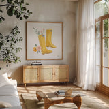 Life in Full Bloom Boots by Jenaya Jackson. Shown in a natural wood frame in a cozy modern living room. Available as an archival giclee rolled canvas, fine art paper, or poster print. SKU 87811a.