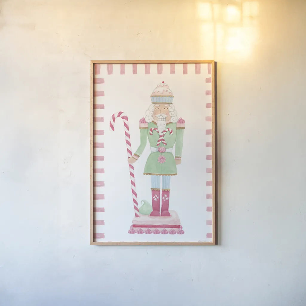 Nutcracker Bakery I Border by Jenaya Jackson. shown as a paper print in a natural frame. Available as a archival giclee rolled canvas, fine art paper, or poster print. SKU 100722h.