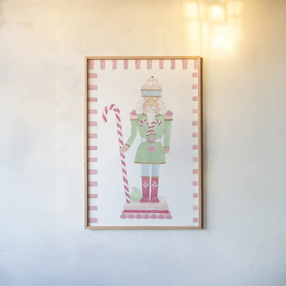 Nutcracker Bakery I Border by Jenaya Jackson. shown as a paper print in a natural frame. Available as a archival giclee rolled canvas, fine art paper, or poster print. SKU 100722h.